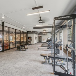 fitness center with open spaces and bright lighting through the windows